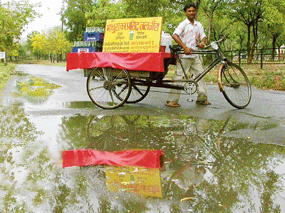 Sudden showers on Saturday afternoon brought much-needed respite from heat for city folk but robbed this jaljeera vendor of customers.