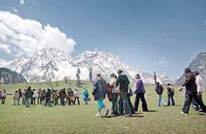 Tourists enjoy their outing at a health resort of Sonmarg along the Srinagar-Leh National Highway which was reopened on Friday. The highway closed again on Saturday due to heavy snow. 