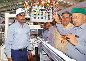 Himachal Pradesh Chief Minister Virbhadra Singh inaugurates Hindustan Lever Limited (HLL) plant in Barotiwala on Sunday as Vice-Chairman of HLL M.K. Sharma (standing on the right of the CM) looks on.