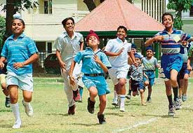 Children participating in 100 metres race at a sports meet organised by Residents Welfare Association, Phase IV, Mohali, on Sunday