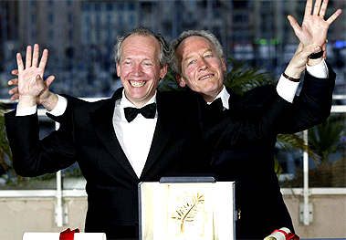Belgian brothers Luc and Jean-Pierre Dardenne pose with the Palme `d'Or trophy they won for their film L`enfant