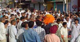 The funeral procession of Satish Narang, a BJP councillor who died on Sunday, passes through the Gaushala road, Abohar, on Monday