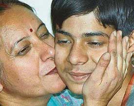 Prince Pahwa receives a hug and a kiss from his mother at his residence in Panchkula on Tuesday