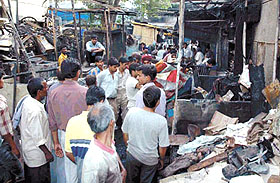 The charred remains of a market at Kashmiri Gate in the Capital on Wednesday