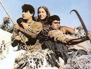Sunil Dutt (right) in a scene from the film Mother India with Nargis and Rajinder Kumar.
