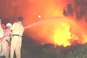 Firemen control the fire which broke out on the Punjab National Fertilizer and Chemicals Limited campus at Nangal