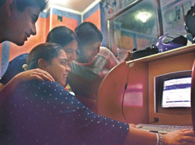 Class 10th students scanning their results on website at cyber cafe in the Capital on Thursday