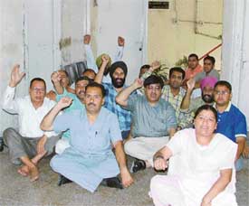 BJP councillors and party workers hold a dharna in front of the Joint Commissioners office in Ludhiana on Thursday