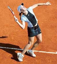 Justine Henin-Hardenne of Belgium serves to Virginia Ruano Pascual of Spain during their match in the second round of the French Open at Roland Garros