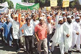 Muslims take part in a protest march against the desecration of the Koran by US soldiers in Guantanamo bay 