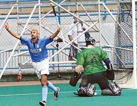 Indias Prabhjot Singh celebrates after getting past New Zealand goalkeeper Paul Woolsord to score the equaliser during a match in the 14th Sultan Azlan Shah Cup Hockey Tournament in Kuala Lumpur on Friday