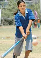 Priti of Rajasthan tries to hit the ball against Kerala during a softball match in Chandigarh on Saturday