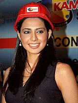 Former Miss India Universe 2003 Nikeeta S. Anand smiles as she models for a company in Patna