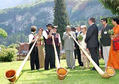President Dr A.P.J. Abdul Kalam trying to play the traditional Swiss instrument Alphorn