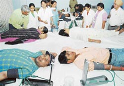 Volunteers donate blood at a blood donation camp held at Sant Nirankari Bhavan, Burail in Sector 45, Chandigarh, on Sunday.