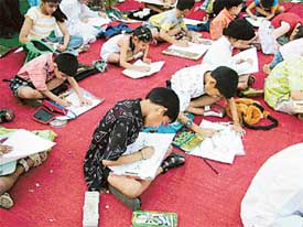 Kids participate in a drawing competition organised by the IDA to mark World No Tobacco Day in Ludhiana