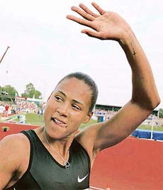 US sprinter Marion Jones gestures after competing in the womens 100 m race at the FBK games in Hengelo, eastern Netherlands