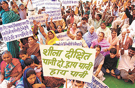 Activists of Swadeshi Jagran Manch, demonstrating outside the Delhi Jal Board headquarters against the shortage of water in the Capital on Tuesday