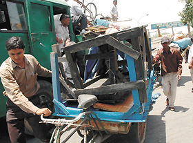 MCD employees removing unauthorised vendors in front of Old Delhi Railway Station in the Capital on Tuesday