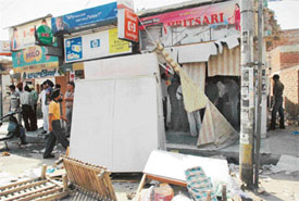 Furniture belonging to a shopkeeper thrown on the road near Ghumar Mandi in Ludhiana on Tuesday