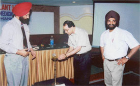 Flanked by Dr B.S. Aulakh and Dr J.S. Sandhu, Dr Jagdeep Whig, Vice-Principal of DMCH, lights the lamp to inaugurate Transplant Update in Ludhiana on Sunday