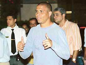 Ronaldo greets people as he arrives at a hospital in Rio de Janeiro on Monday. Ronaldo has been dropped from the Brazilian team for two upcoming World Cup qualifiers and the Confederations Cup