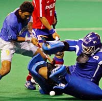 Deepak Thakur is blocked by goalkeeper Yong Ho-shin of South Korea during their match in the 14th Sultan Azlan Shah Cup hockey tournament in Kuala Lumpur on Tuesday