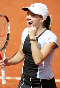 Belgium's Justine Henin-Hardenne reacts after defeating Russia's Maria Sharapova