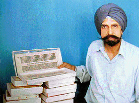 Avtar Singh with his collection of rare books