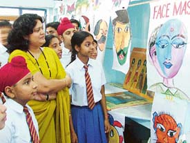 Ms Namita Raj Singh, Head Mistress, Kundan Vidya Mandir, city branch, with children during the summer camp organised on the school campus on Tuesday.