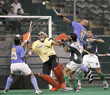 Len Aiyappa (second from right) jumps up as he battles for the ball in the match against Pakistan in the 14th Sultan Azlan Shah Cup hockey tournament in Kuala Lumpur on Wednesday.
