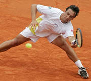 Mariano Puerta of Argentina returns the ball to compatriot Guillermo Canas during their quarterfinal match in the French Open at Roland Garros on Wednesday. The unseeded Puerta won to reach the semifinals.