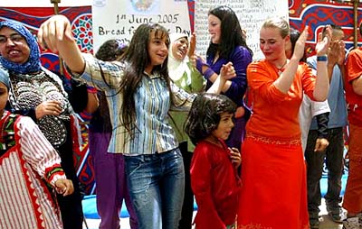 Jewish, Israeli and Palestinian women and girls dance together during a celebration aimed at promoting peace in the Mid East