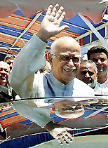 BJP leader L.K. Advani waves as he leaves the Pakistan Assembly in Islamabad on Wednesday