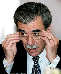 US Commerce Secretary Carlos Gutierrez delivers a speech in Beijing on Thursday