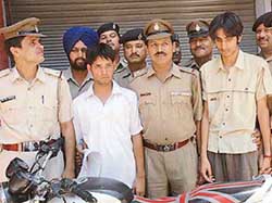 Sumit Dhiman and Ajay Bhandari, who were traced using the stolen mobile phone of a woman, in police custody at Sector 19 police station, Chandigarh, on Thursday. 