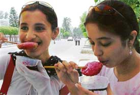 Girls enjoy ice-lollies to beat the heat in Ludhiana