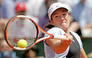 Justine Henin-Hardenne of Belgium hits a forehand shot during her semifinal match against Nadia Petrova of Russia in the French Open