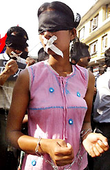 Nepalese students wear blindfolds and tie their hands with chains during a rally in protest against the political conditions and clampdown on the Press by King Gyanendras administration in Kathmandu on Thursday.