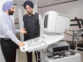 Mr Shivinder Mohan, Joint MD of Fortis (left), discusses a point with Mr Harpal Singh, Chairman of Fortis, during the inauguration of Fortis City Centre Hospital at Sector 9 in Chandigarh on Friday. 