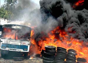A bus and tyres burn after a fire broke out in the Haryana Roadways depot in Industrial Area, Phase I, Chandigarh, on Saturday.