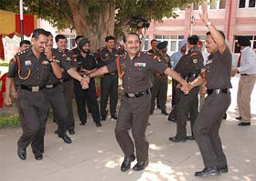 Officers of the Brigade of Guards dance during a get-together in Jalandhar