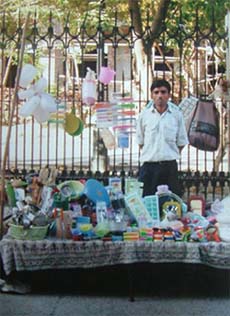 Hans Raj Parvesh Kumar, a victim of Operation Bluestar, sells plastic items in the corridor surrounding the Golden Temple