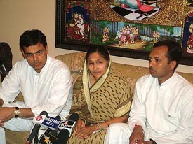 Newly elected Congress MLA from Hisar Savitri Devi Jindal, along with her sons, Sajjan and Naveen, after her election in Hisar on Sunday