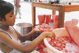 Watermelon being sold under unhygienic conditions on the Deepak Cinema road 