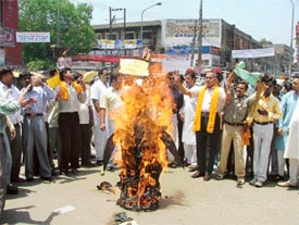 Shiv Sena activists burn an effigy of terrorism in Ludhiana on Sunday to protest against the SGPC move to construct a martyrs memorial in the Golden Temple