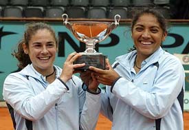 Spains Virginia Ruano Pascual  and Argentinas Paola Suarez hold the trophy after winning the womens doubles final at the French Open in Paris on Sunday