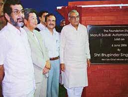 Haryana Chief Minister Bhupinder Singh Hooda lays the foundation stone for a new plant of Maruti Udyog Ltd at Manesar in Gurgaon on Monday. Ambassador of Japan to India Enoki and Managing Director of Maruti Udyog Limited Jagdish Khattar are also seen in the picture.