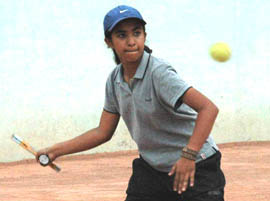 Arshi Khosla in action against Arpan during the first round of AITA series in Chandigarh on Monday.