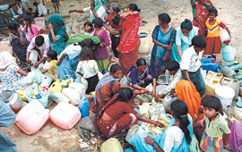 Vasant Vihar jhuggi basti dwellers reeling under water problem in the Capital on Monday.